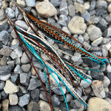 Neutral palette with blue grizzly long feather earrings