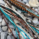 Neutral palette with blue grizzly long feather earrings