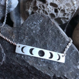 Stainless steel openwork moon phases necklace